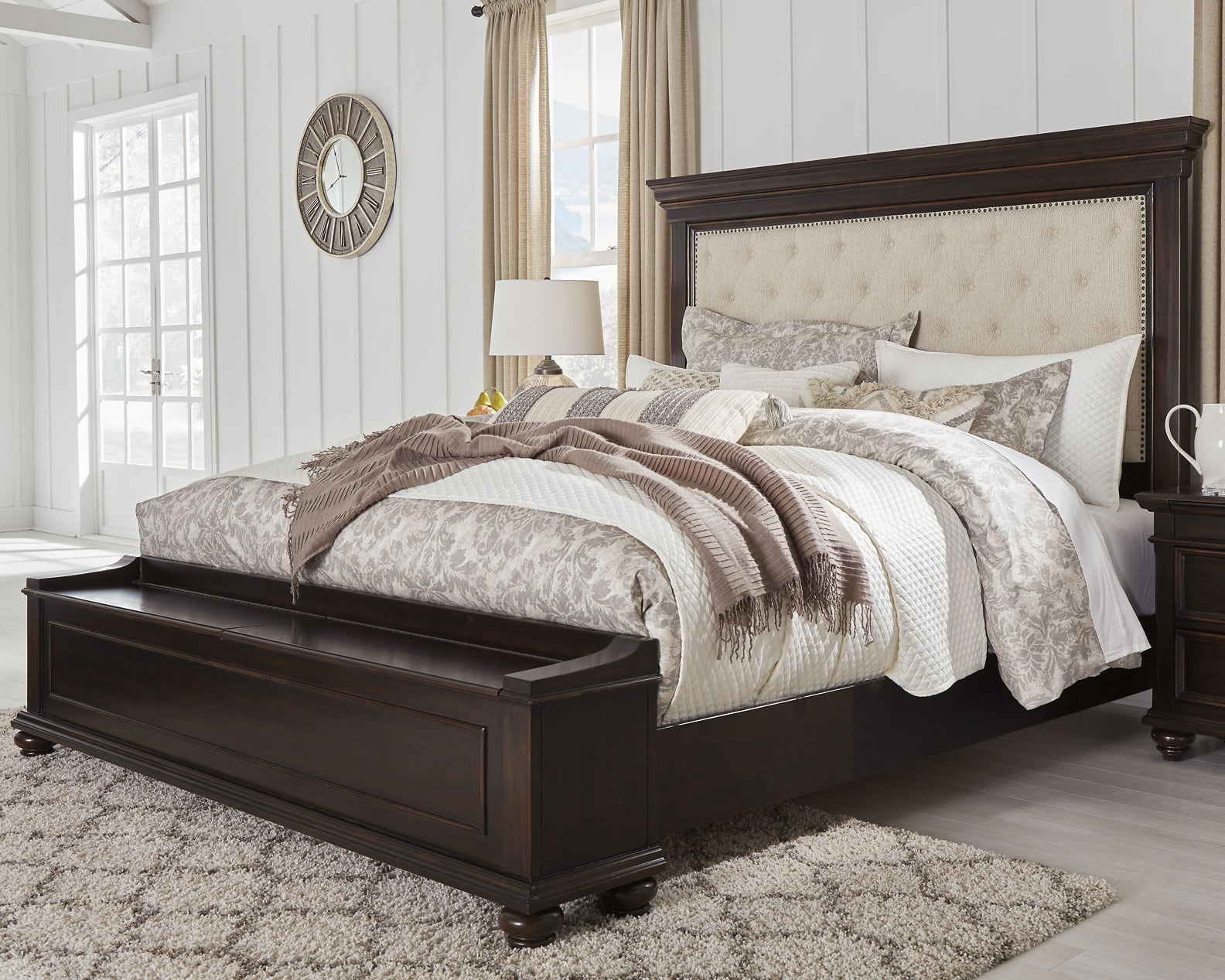 Hyndell Dark Brown King Upholstered Panel Bed with Storage